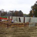 Medallion Developers employees hard at work on a concrete foundation for a home basement