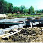 Concrete block foundation with steel beams